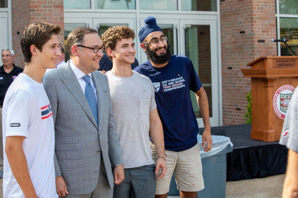 Chancellor Andrew D. Martin poses with WashU students