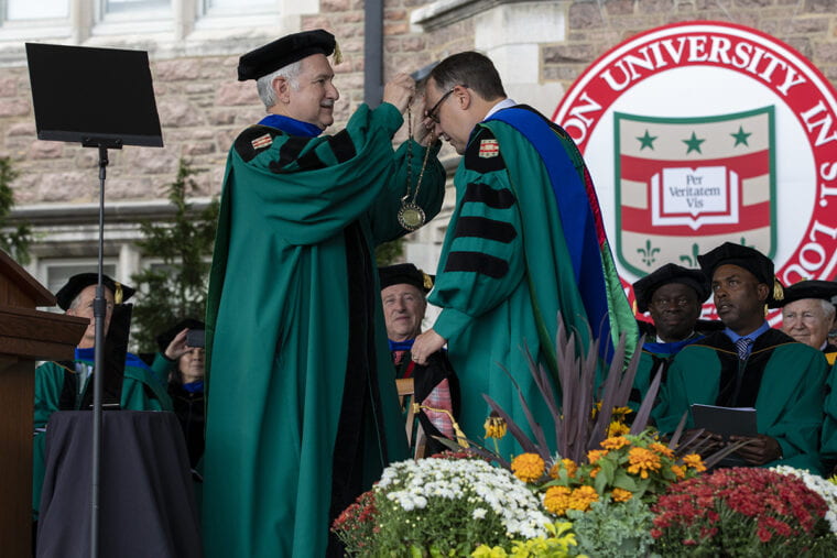 Andrew D. Martin receiving the WashU medallion