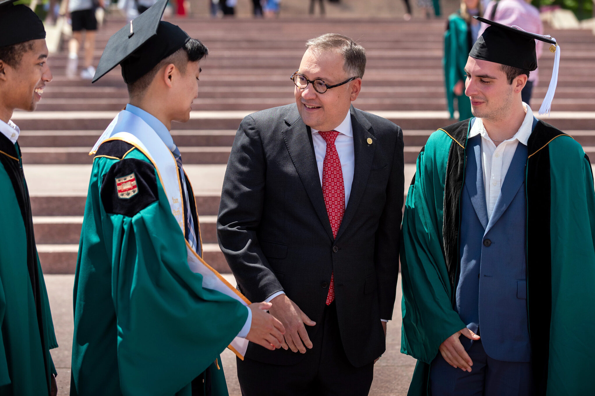 Chancellor Andrew D. Martin congratulates graduates