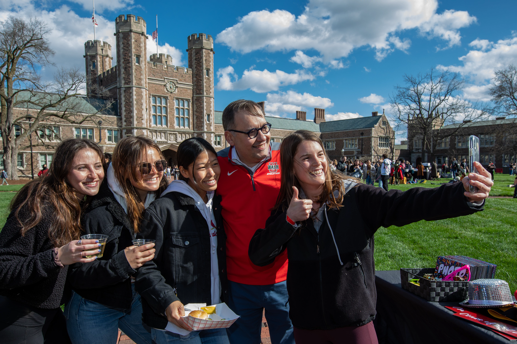 Soon-to-be graduates take a selfie with Chancellor Martin