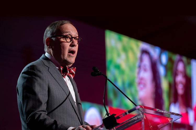 Andrew Martin speaks at lectern at event